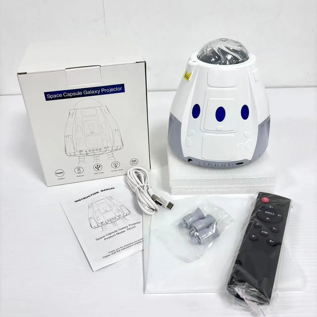 Creative USB space capsule starry atmosphere projection lamp in Space White with remote control on a bedside table