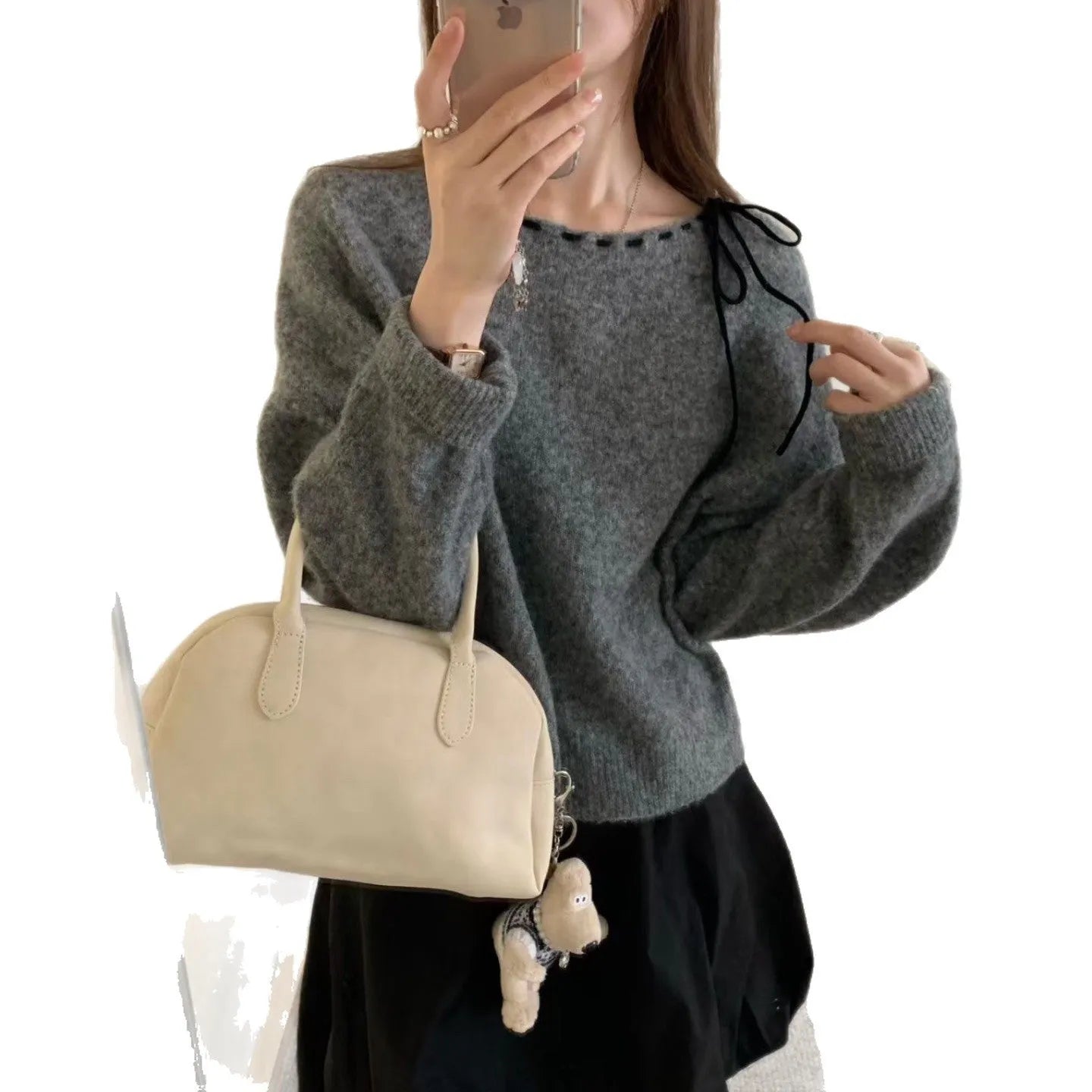 Grey loose-fit women's pullover knitwear on a hanger