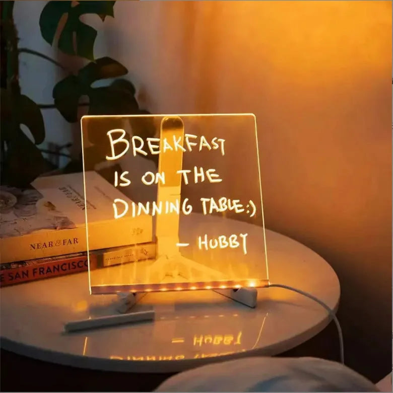 Acrylic DIY note board LED night light with pens on desk, showing written message and soft glow