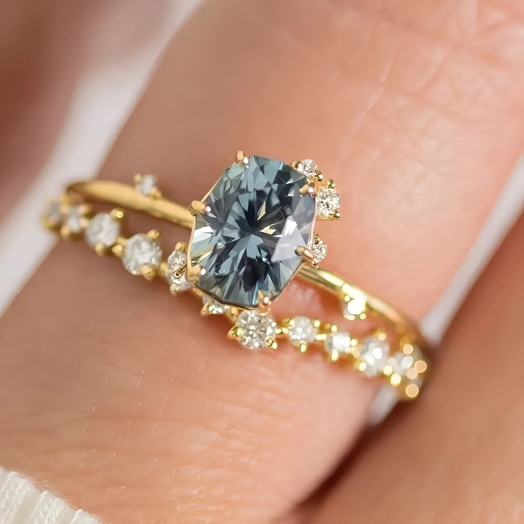 Gold electroplated flower-shaped alloy ring with a central green zircon stone.