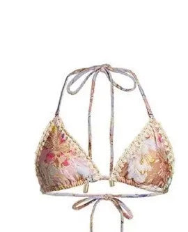 Women's floral print bikini set with skirt in creamy-white beige, shown on a mannequin