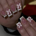 Set of short false nails with white French manicure, tulip, bow, starry sky, and leopard print designs.