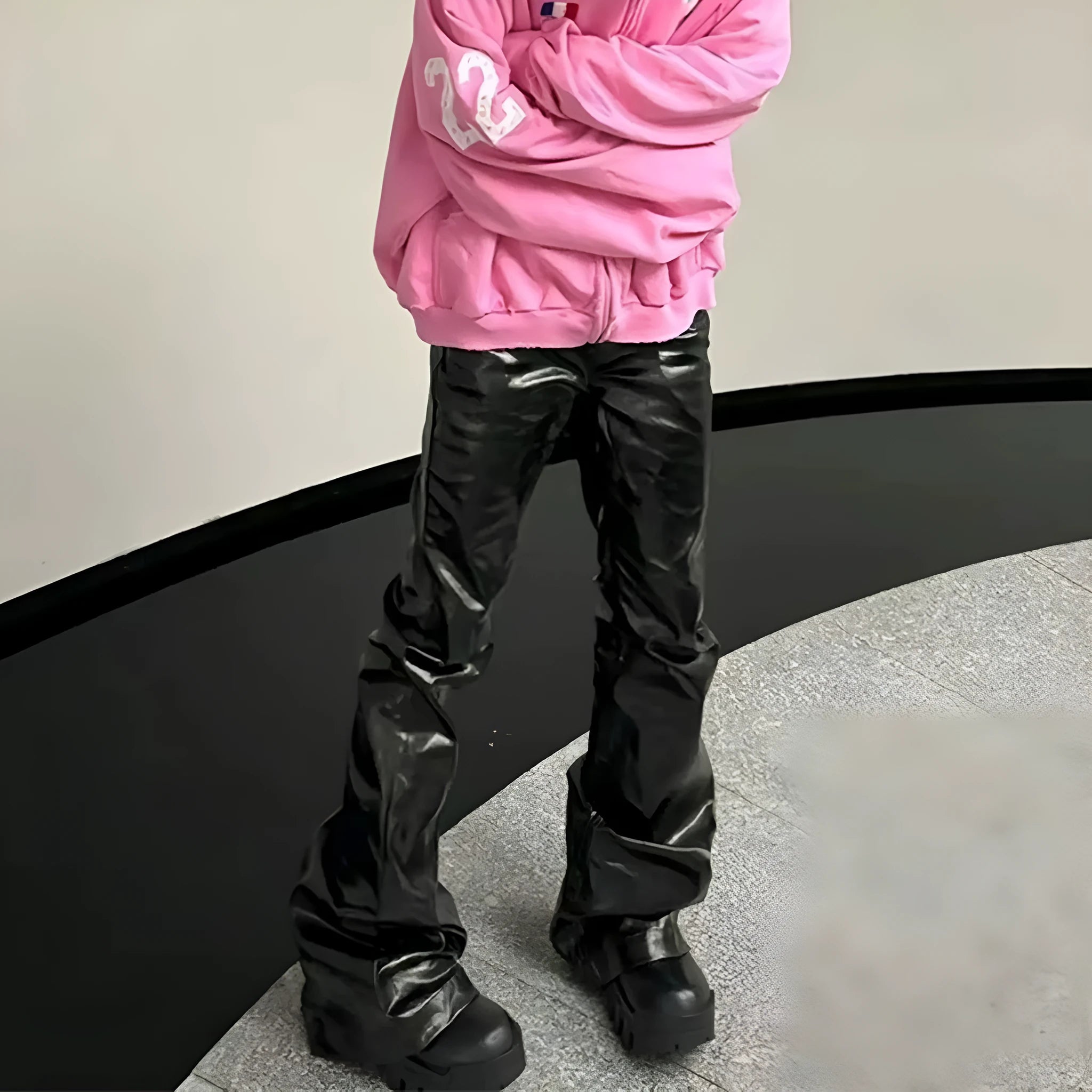 Black coated shiny patent leather straight-leg skinny jeans on a mid-waist