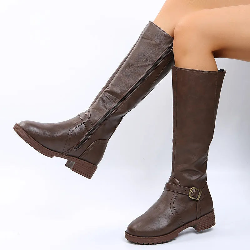 Women's solid colour knight boots with square heel, round toe, and belt buckle detail on a white background