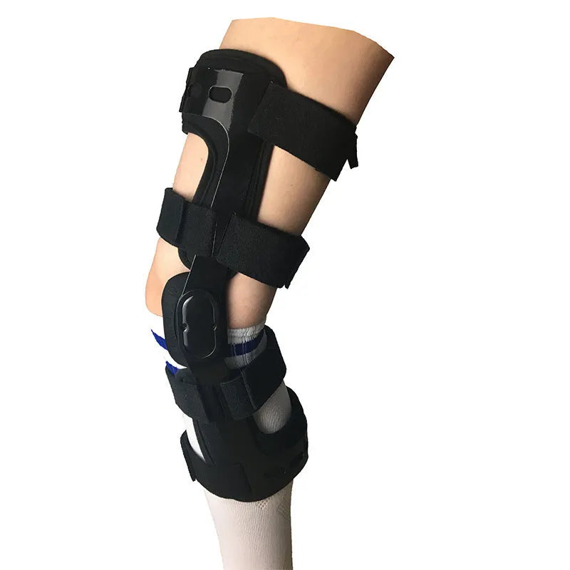 Black anterior cruciate ligament knee brace with visible metal side stays and hinges on a leg.