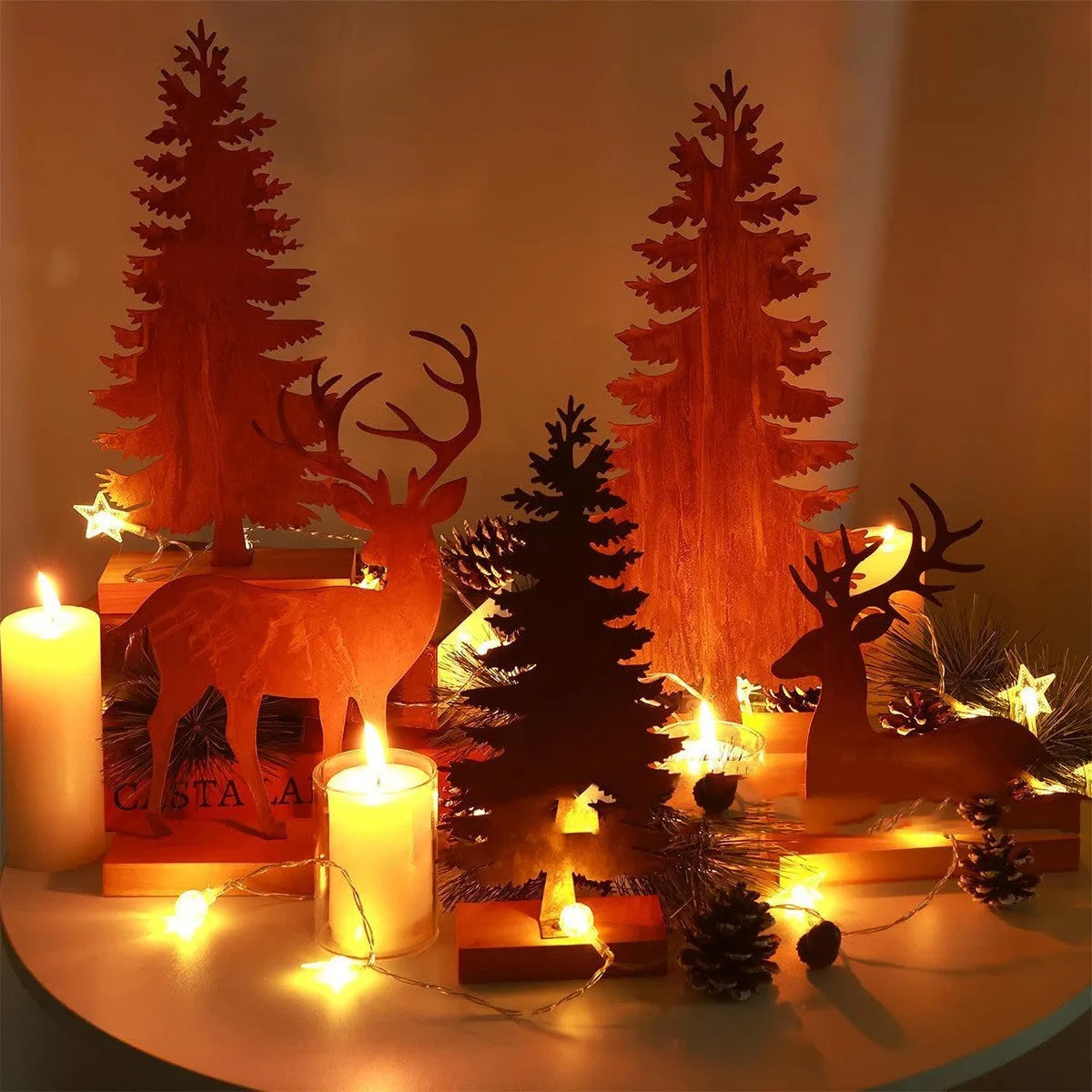 Three rusty metal Christmas decorations with elk and tree designs on white background