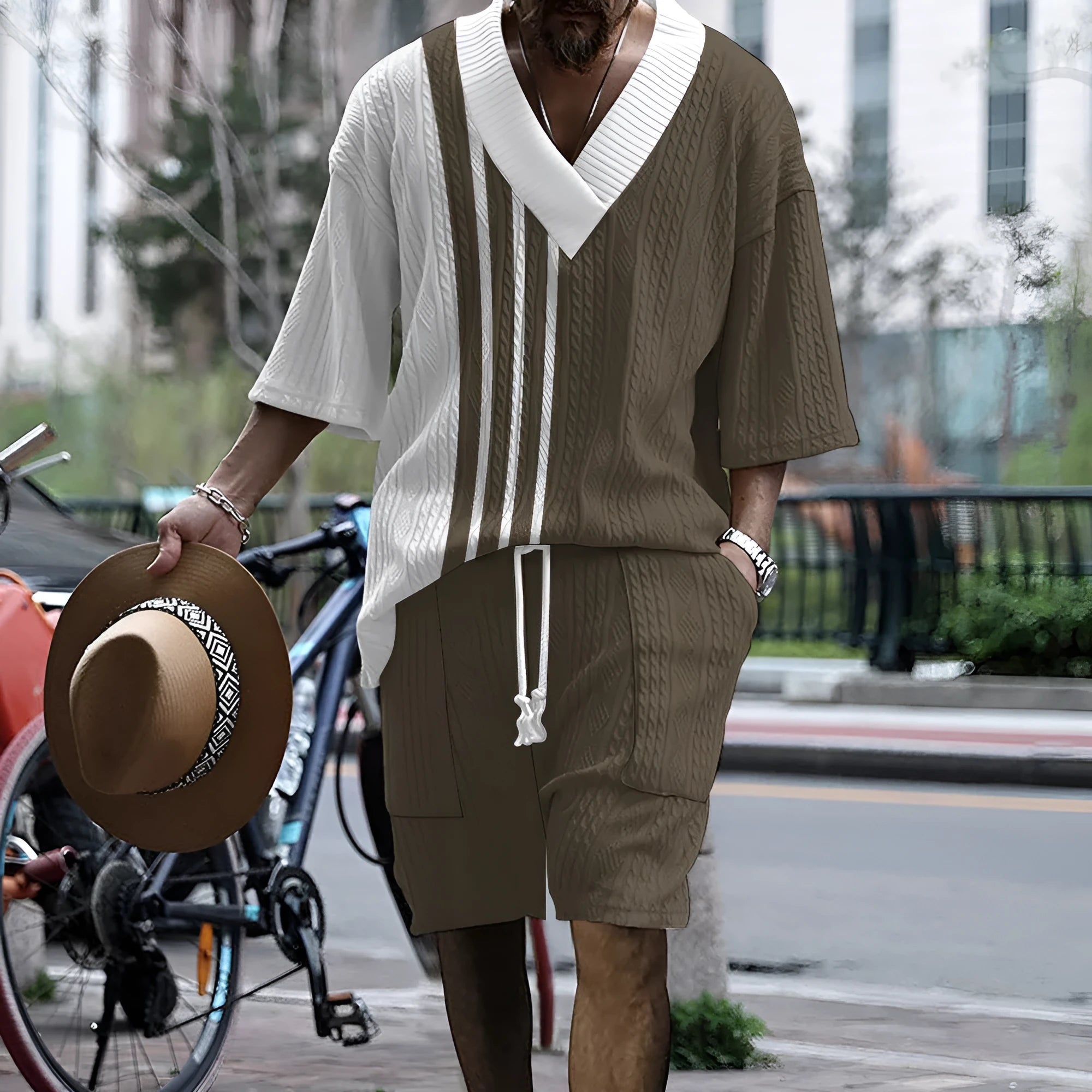 Men's printed drop-shoulder knitted short-sleeve top and matching shorts set on a hanger.