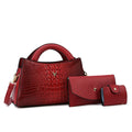 Women's black crocodile pattern PU leather crossbody handbag with gold hardware, shown open to reveal internal organiser pockets.