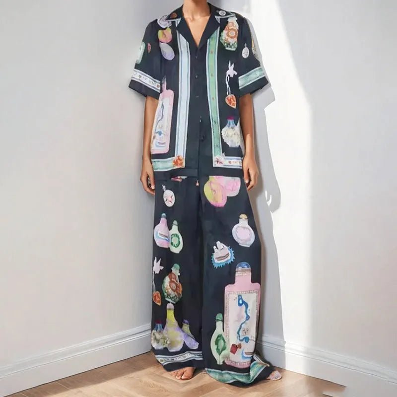 Black women's casual set with cartoon print, featuring a cardigan and trousers