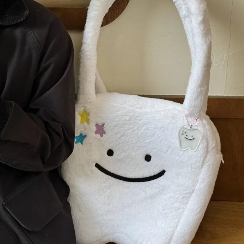 White plush large tooth shoulder tote bag with zipper closure and unisex design