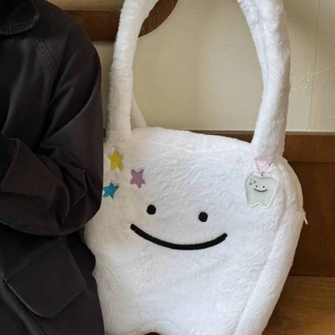 White plush large tooth shoulder tote bag with zipper closure and unisex design