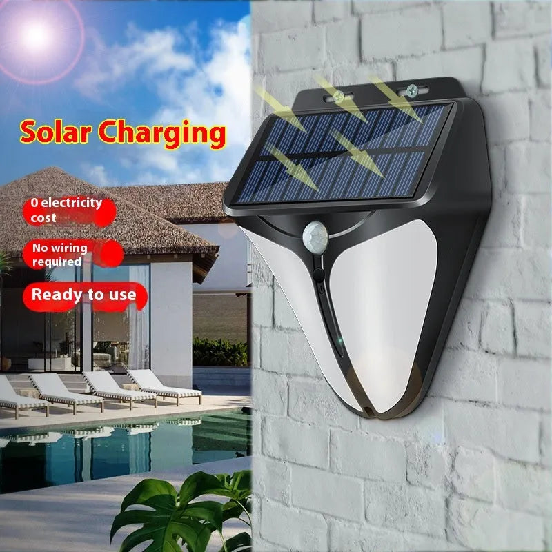 Heart-shaped human induction solar wall lamp mounted on wall with warm light glow