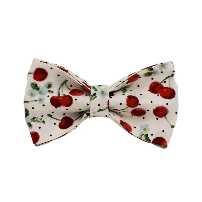 Red cherry printed dog collar set with light gold buckle and bow strap on cloth leash