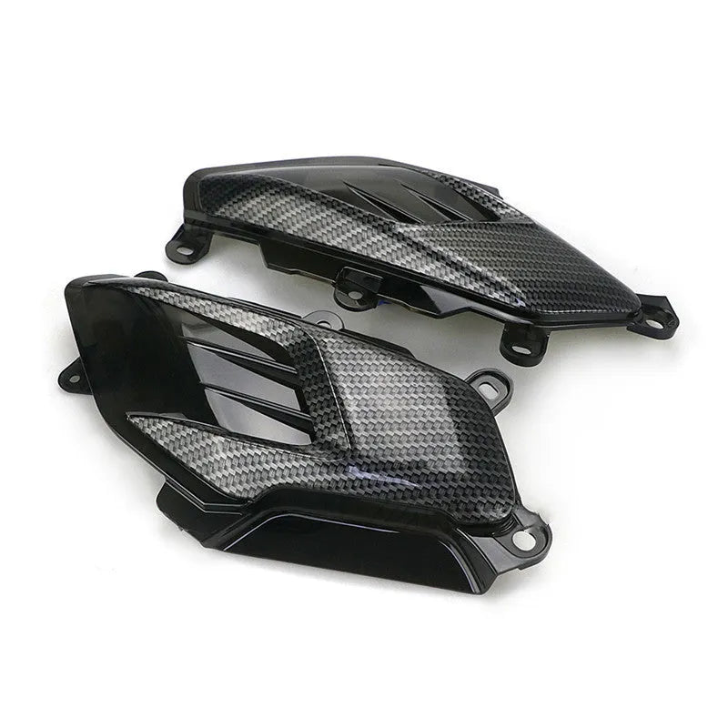 Pair of Yamaha NMAX LED side lamps with carbon fibre decoration, showing blue and red illumination options.