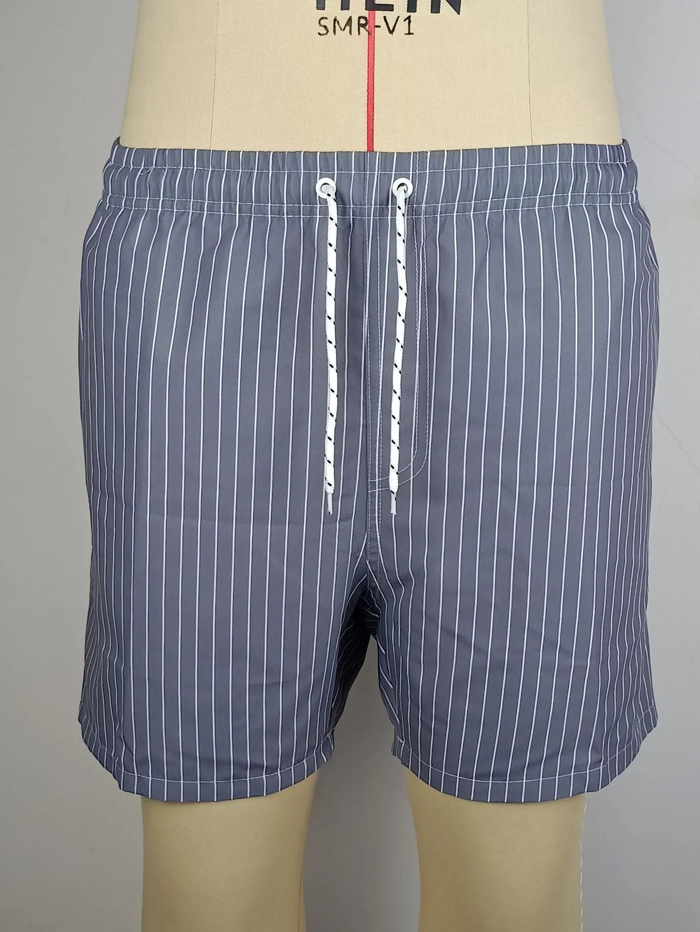 Striped polyester beach shorts with straight leg opening in navy blue grey khaki light blue colours