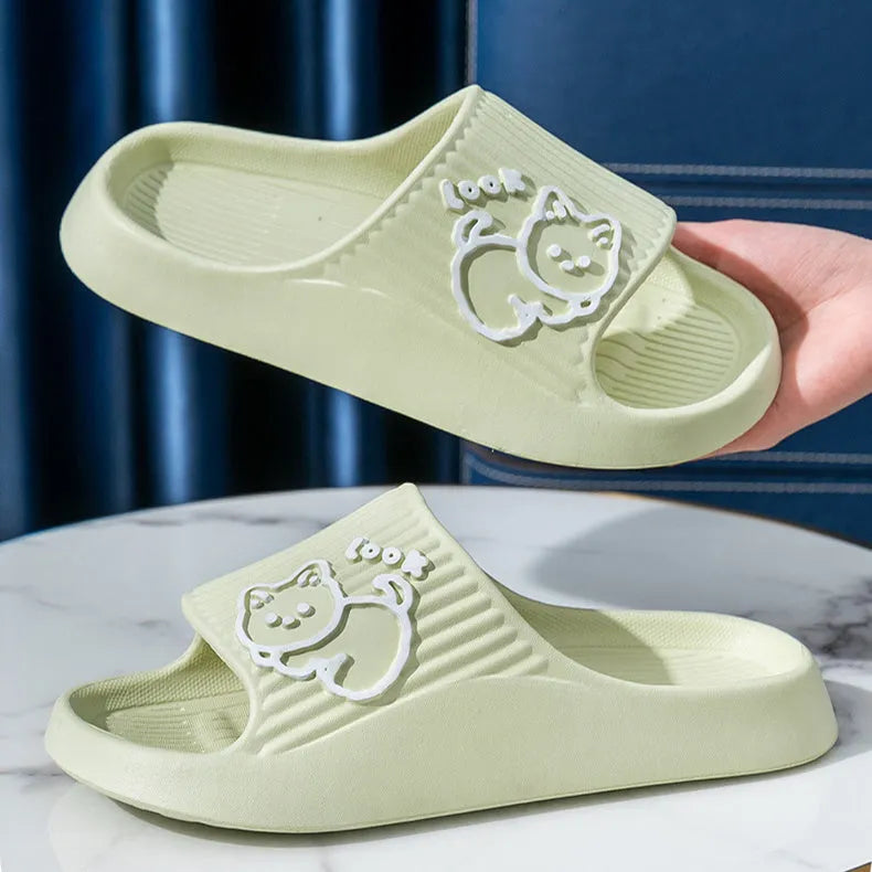 Green EVA platform slippers with a cat design on the upper, showing the thick non-slip sole.