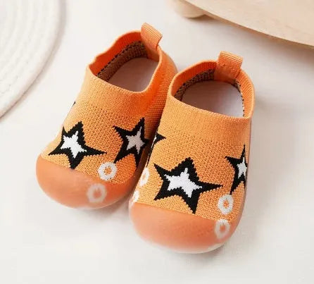 Baby soft sole non-slip walking shoes in cream yellow with fly woven cotton upper and natural rubber sole
