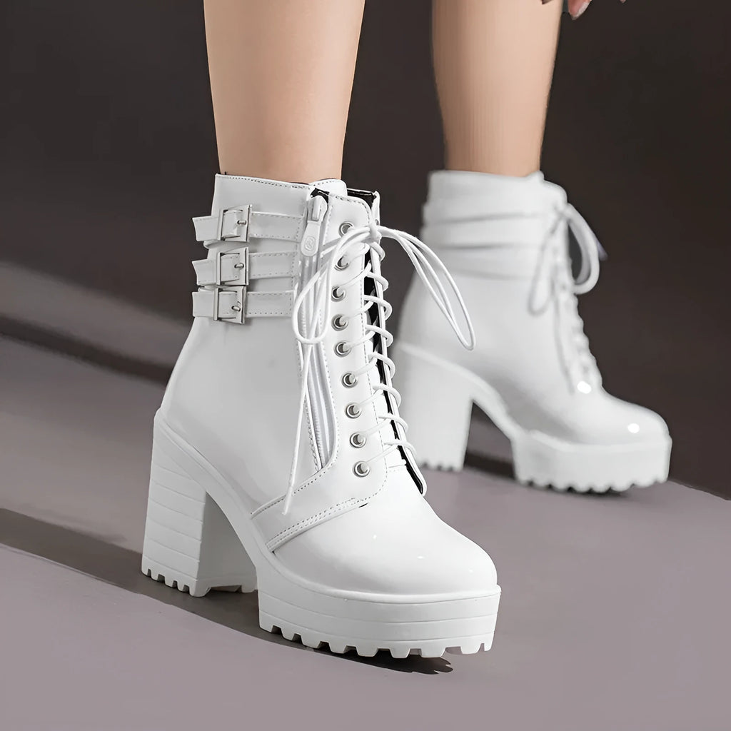 Women's black thick-heeled short boots with lace-up front and round toe, showing waterproof platform detail