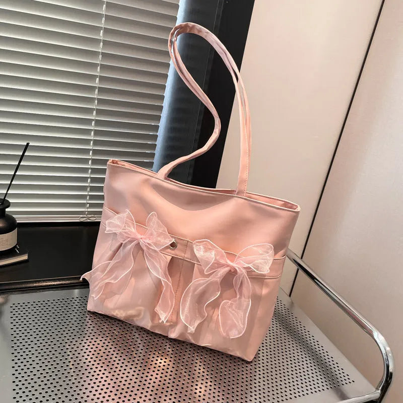 College style bow tote bag in black with large capacity, PU material, and double shoulder straps