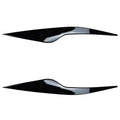 Ford Focus headlight sticker in carbon fiber pattern applied as external eyebrow trim on a car headlight