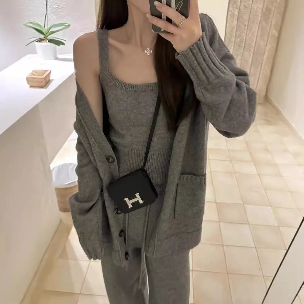 Women's light brown wool-blend knit cardigan vest and loose trousers three-piece set laid flat