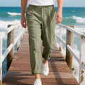 Men's light grey linen casual trousers with a loose straight leg and drawstring waist