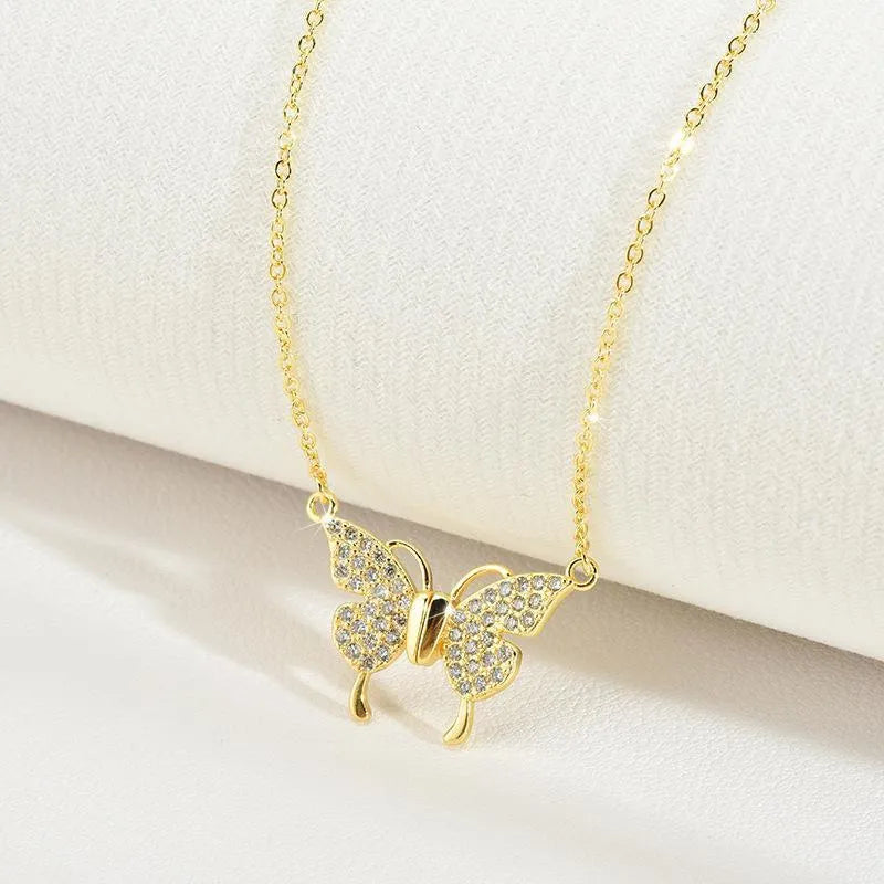 Gold titanium steel necklace with magnetic butterfly pendant on twisted chain