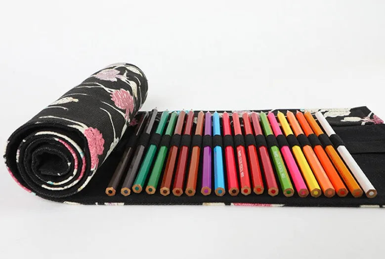 Square canvas pencil case with ballet girl print, showing multiple holes for organising pencils and stationery.