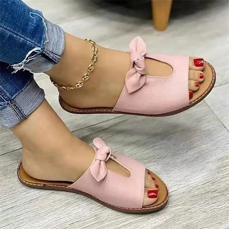 Ladies fish mouth sandals with a bow on the artificial PU upper, shown in black, pink, and gold colours.