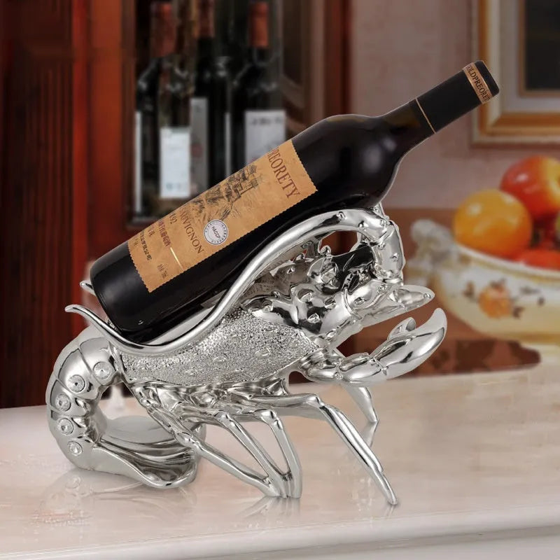 Lobster-shaped wine rack ornament in rose gold metallic finish displaying wine bottle