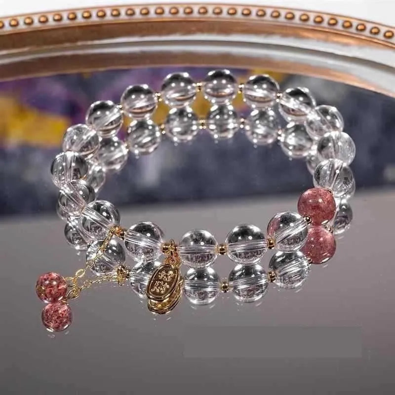 Natural white crystal lucky fortune bracelet on display with beads arranged in a U-shape on a neutral background.