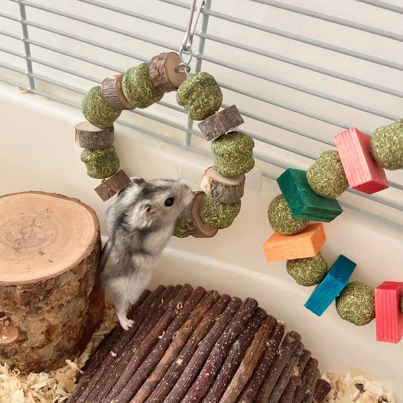 Natural applewood straw ball hamster chew toy with colourful sequin rings for guinea pigs and rabbits.