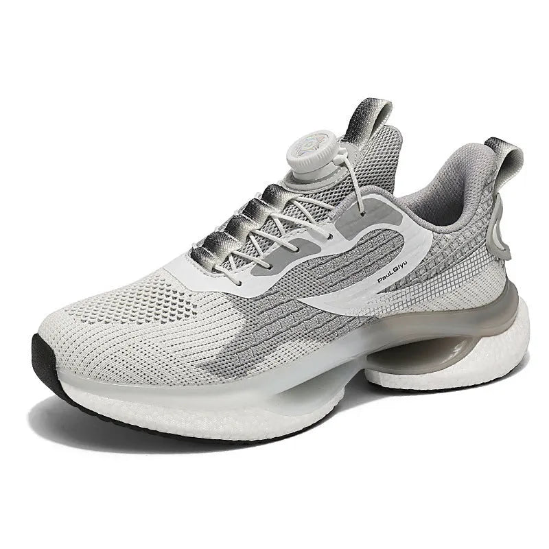 Men's white low-top running shoe with a rotating silver buckle on a grey background.