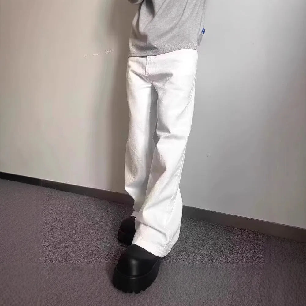 Men's loose fit straight leg white denim jeans on a hanger, showing wide leg opening and zipper fly.