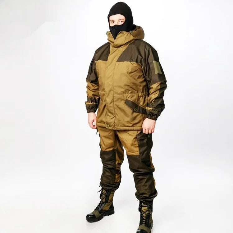 Men's special forces tactical jacket and trousers set in olive green, shown in an outdoor setting.