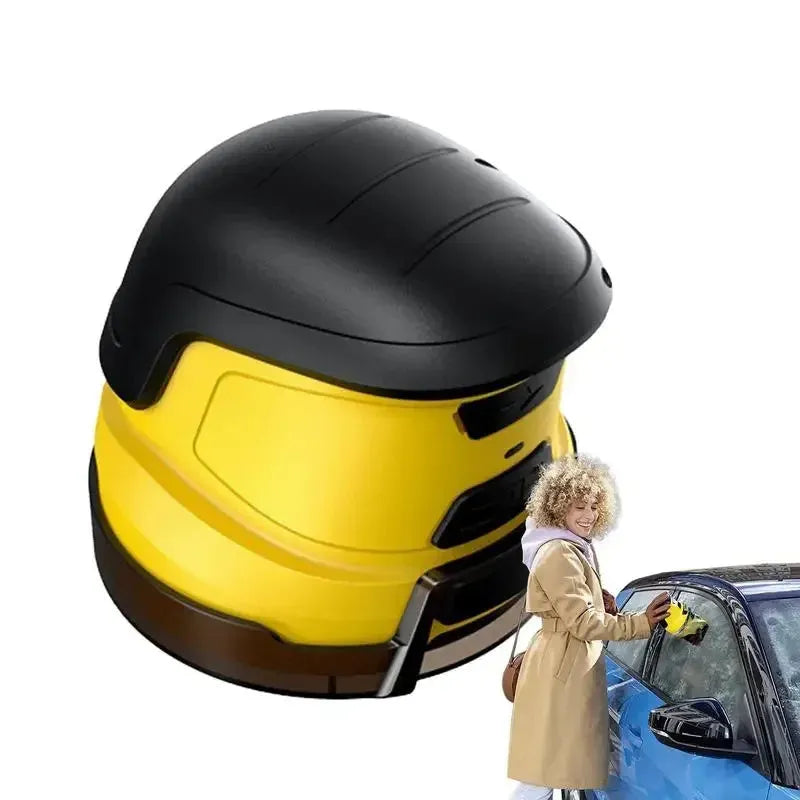 Yellow cordless electric car ice scraper with USB charging cable on a car windshield.