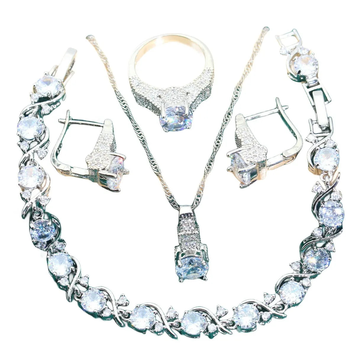 Bridal jewellery four-piece set with zircon pendants showing necklace, bracelet, earrings and ring with water wave chain design