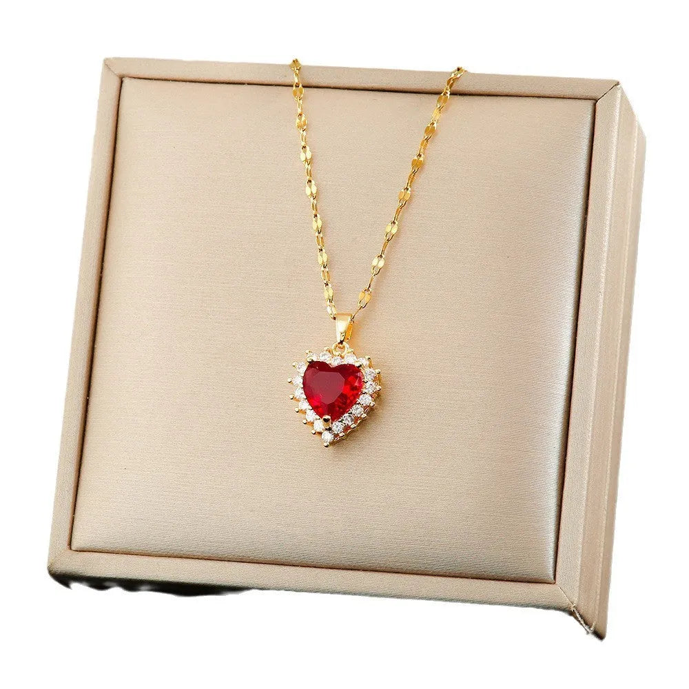 Red gold titanium steel heart flower necklace set with gem inlay pendant, matching ear studs, and ring on water wave chain