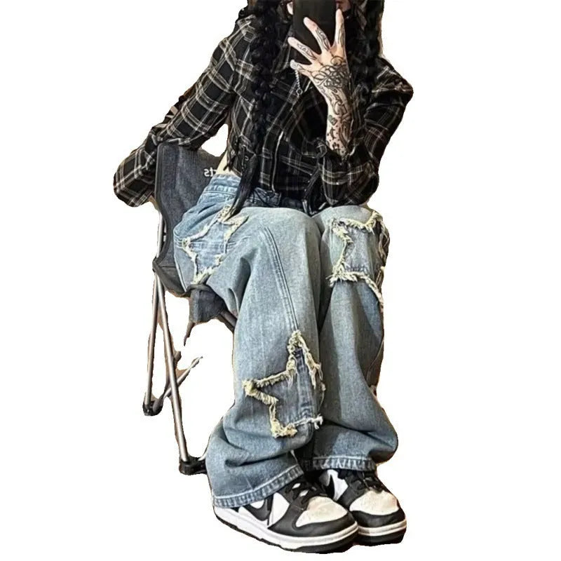 Blue high-waisted wide-leg women's denim trousers on a hanger.