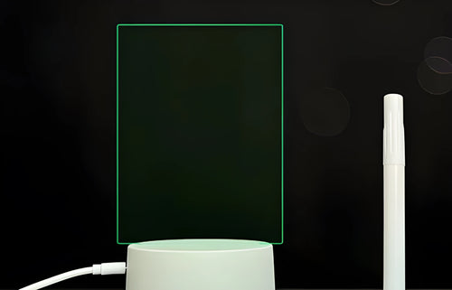 3D acrylic message board with LED lighting and a stylus pen on its illuminated surface