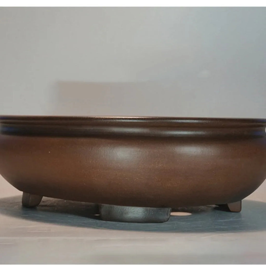 Handmade classical purple clay flowerpot for indoor desktop use.