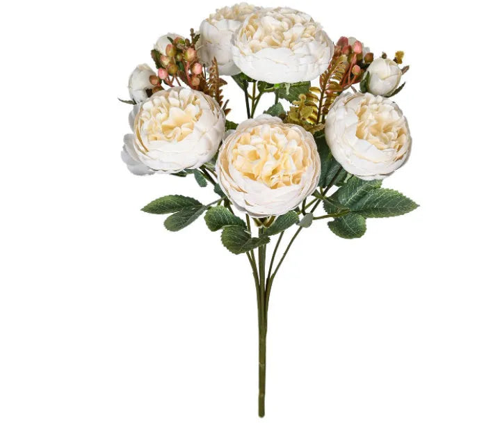 Artificial silk peony bouquet in a champagne colour for home or wedding decoration.