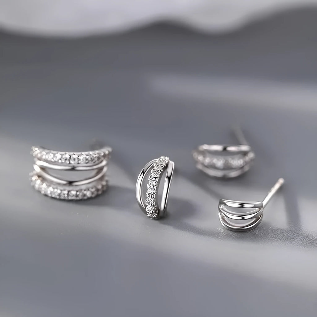 A pair of geometric-shaped 925 silver tone earrings with hypoallergenic needle studs, shown in large size.