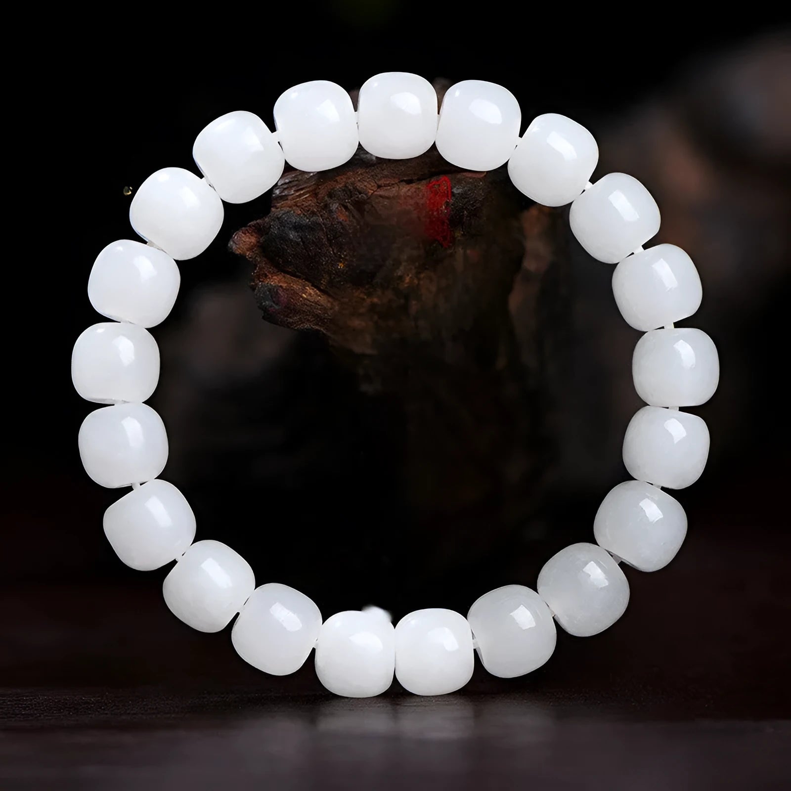 White Hetian jade barrel bead bracelet on a wrist, showing three bead size options for men and women.