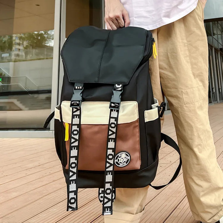 Oxford cloth backpack in black, green, or red with handheld and shoulder straps