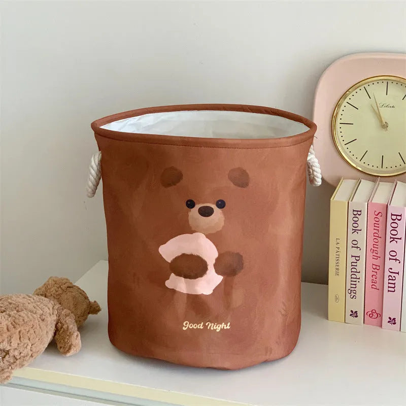 Foldable cotton laundry basket showing one of twelve colour patterns including animal motifs