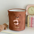Foldable cotton laundry basket showing one of twelve colour patterns including animal motifs