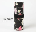 Square canvas pencil case with ballet girl print, showing multiple holes for organising pencils and stationery.