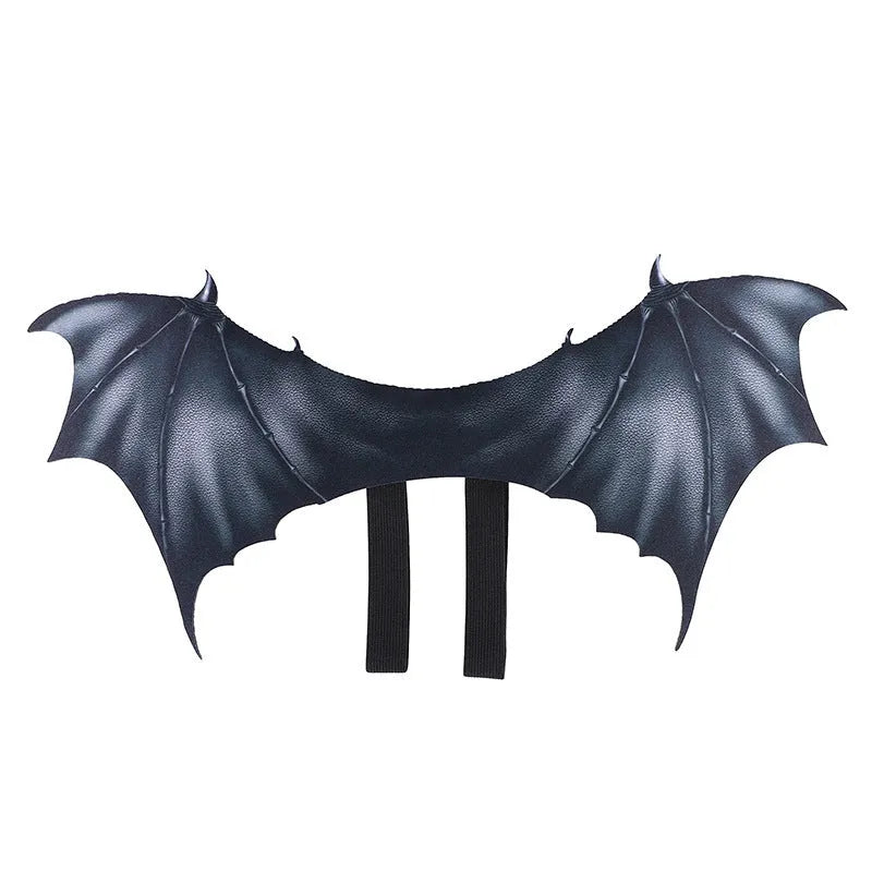 Black cloth bat wing costume for dogs and cats on a pet, showing three available sizes.