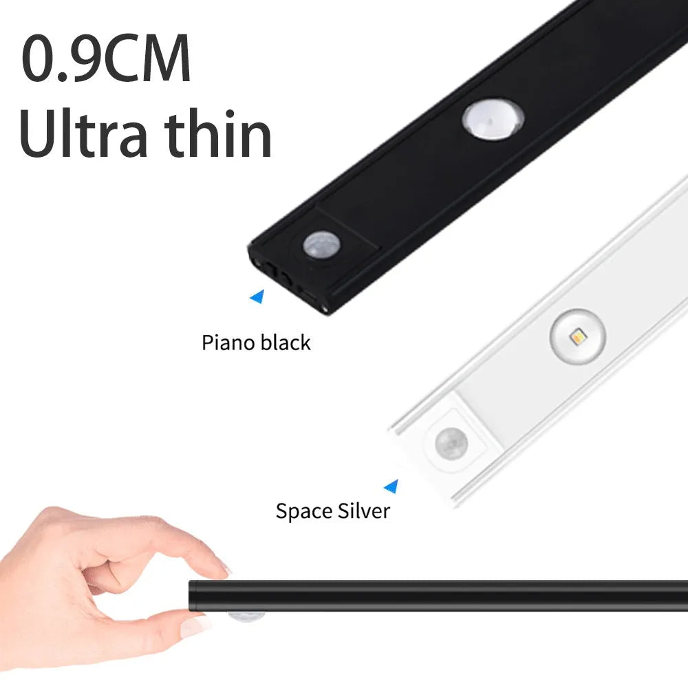 Ultra-thin USB LED night light with motion sensor in silver, aluminium body, 20 cm length, mounted inside a kitchen cabinet
